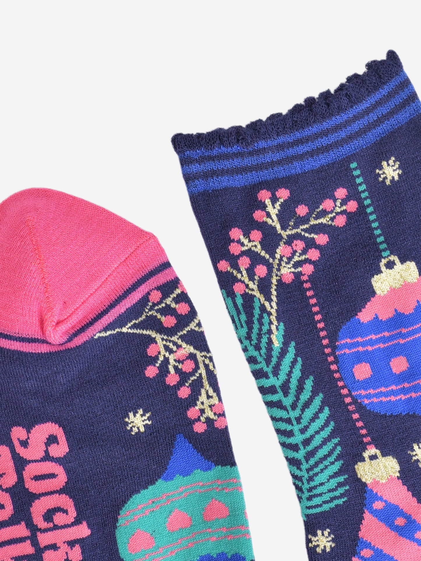 close up of the toe and cuff, the toe is pink, the cuff is scalloped with blue stripes