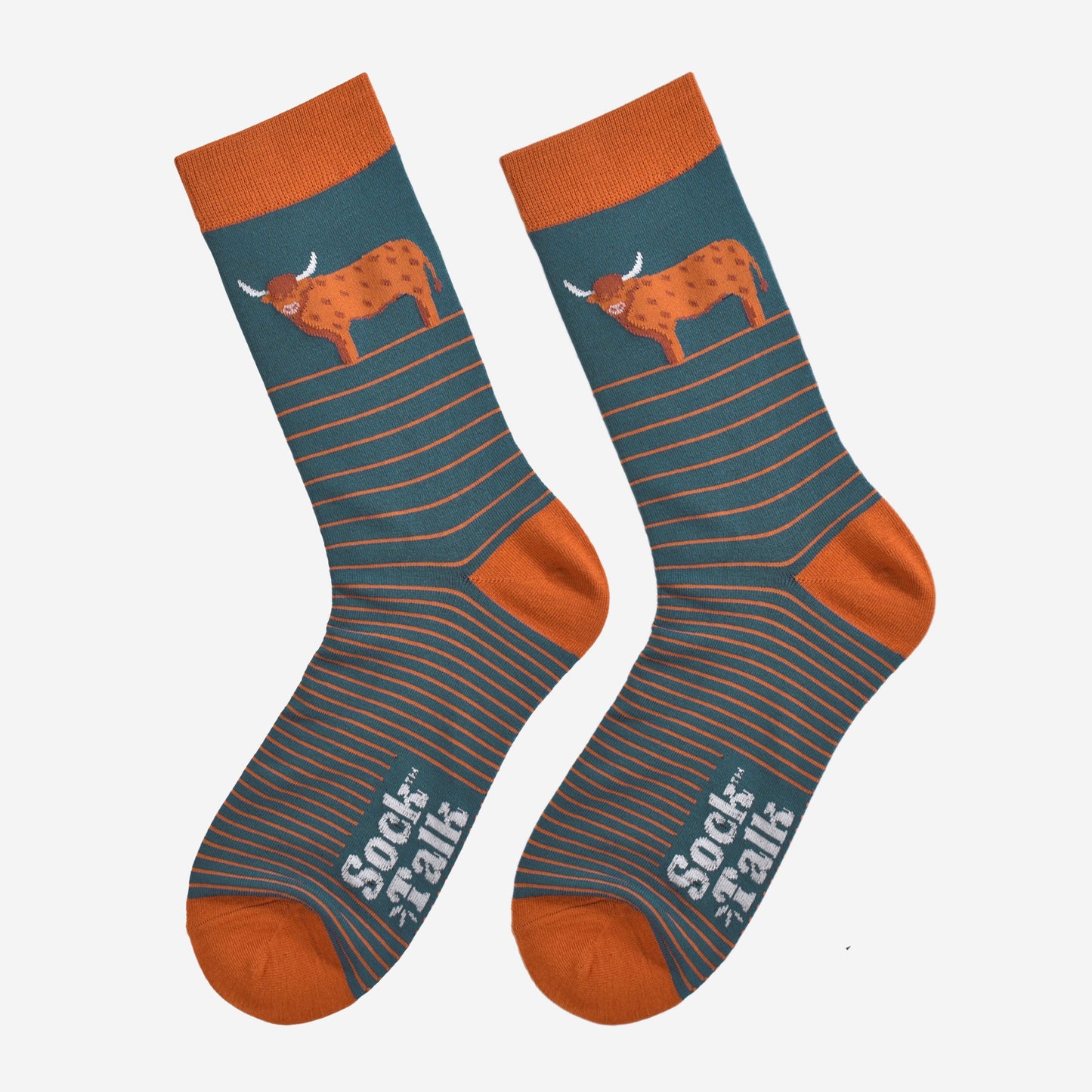 teal and orange striped bamboo socks laying flat, there is a large highland cow on the ankle of the sock, the cow is in profile and standing up