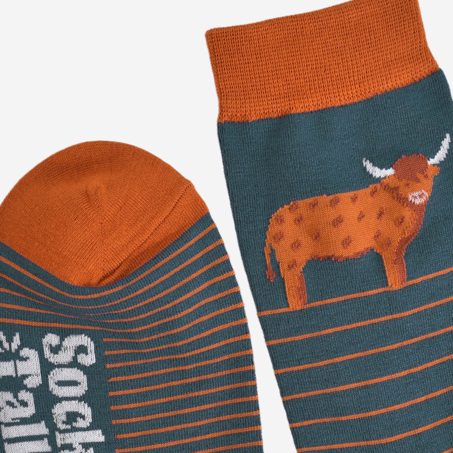 close up of the toe and the cuff of the socks, showing the prominent stripe pattern and large highland cow on the ankle