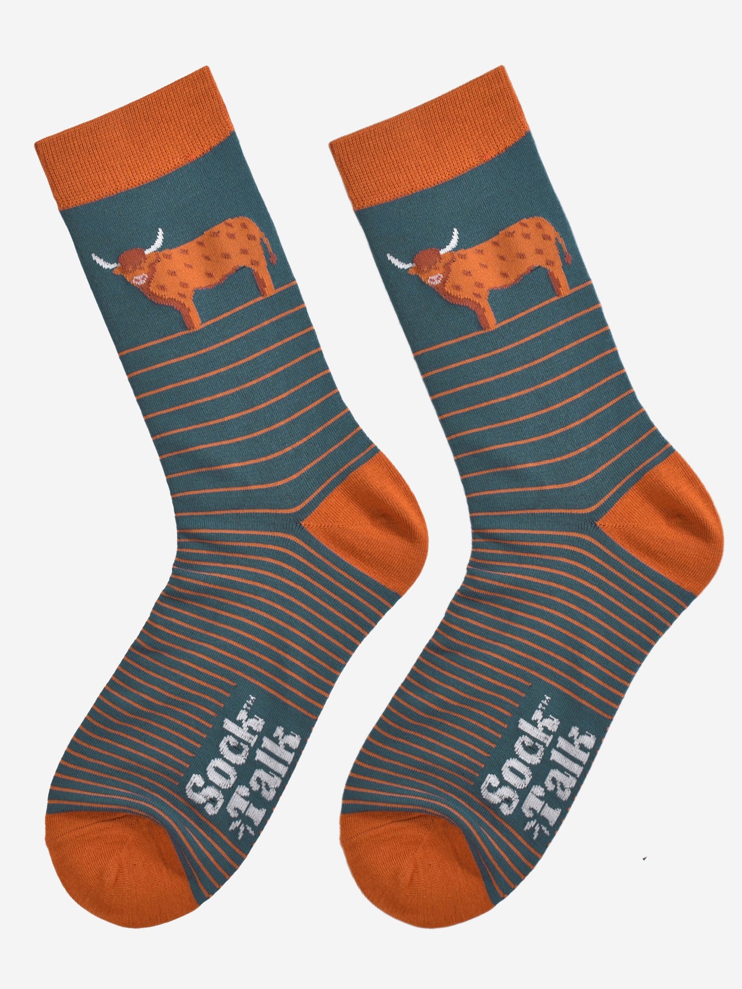 teal and orange striped bamboo socks laying flat, there is a large highland cow on the ankle of the sock, the cow is in profile and standing up