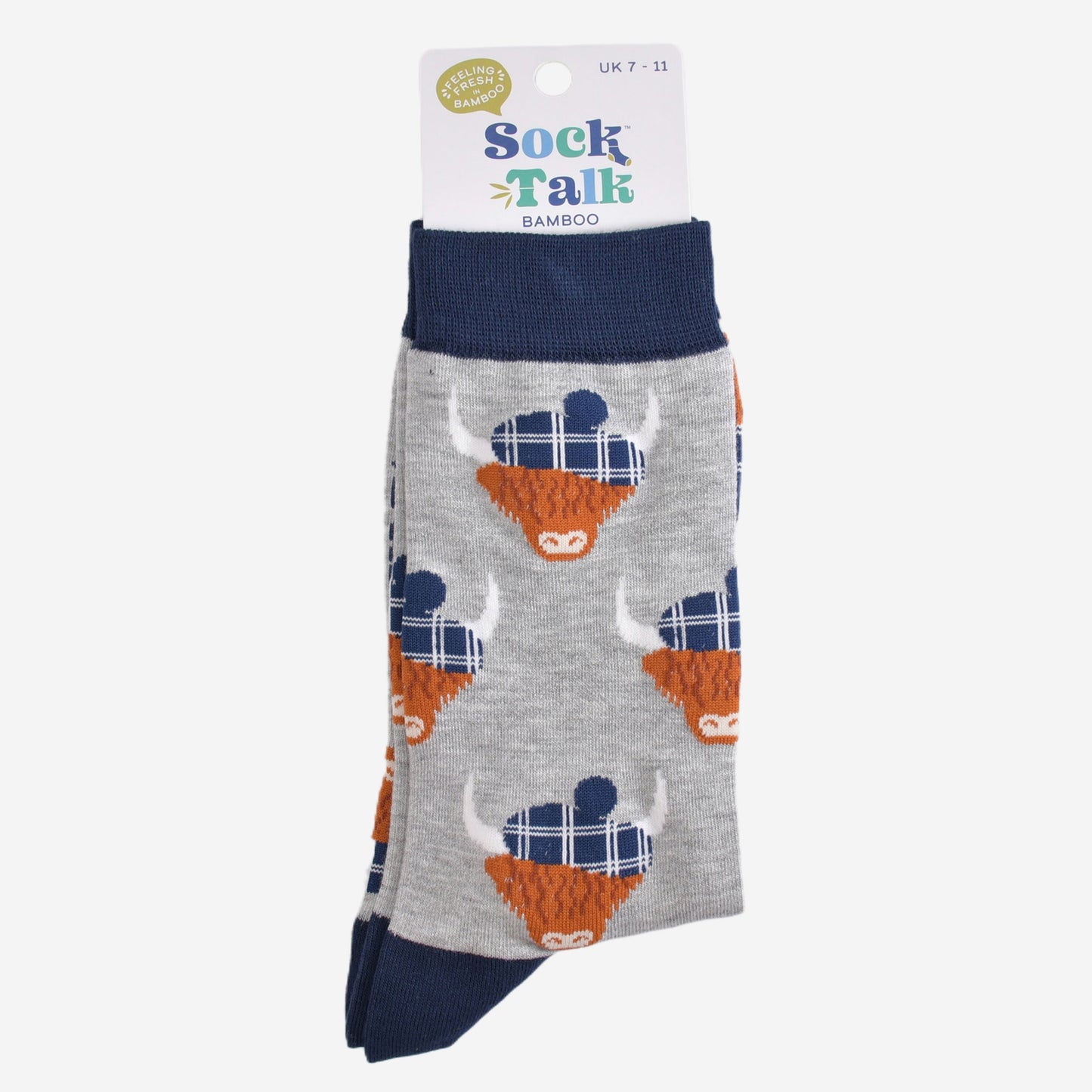 grey and navy blue highland cow socks with their sock talk packaging, these socks are uk size 7-11