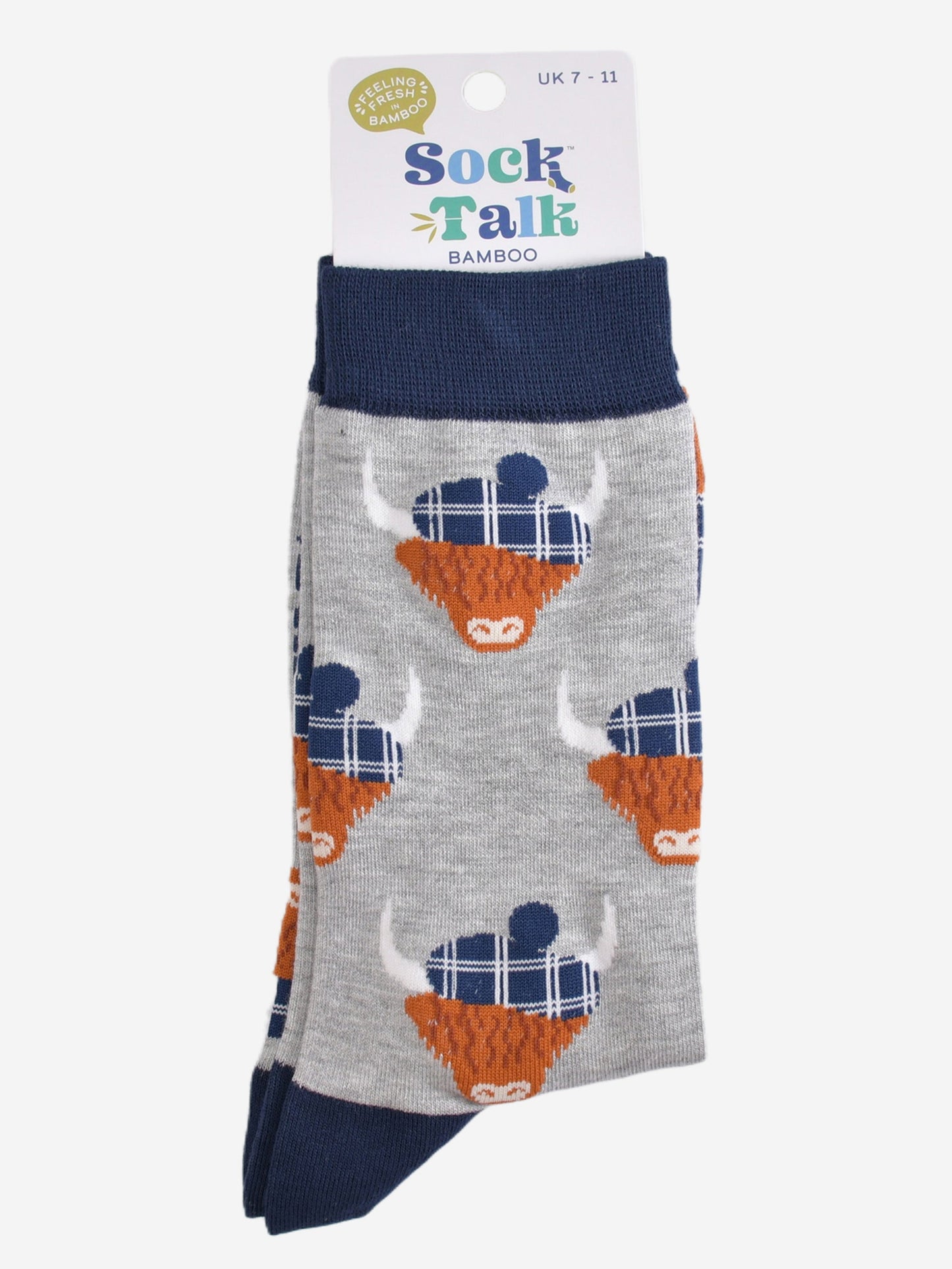 grey and navy blue highland cow socks with their sock talk packaging, these socks are uk size 7-11