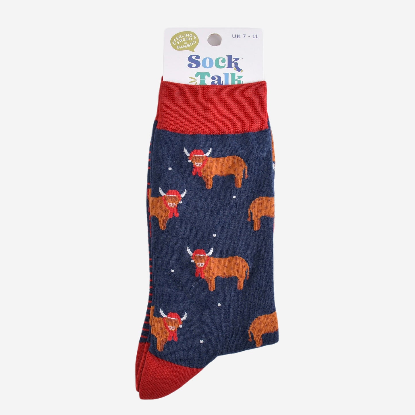 navy blue and red highland cow bamboo socks in their sock talk packaging, these socks are uk size 7-11