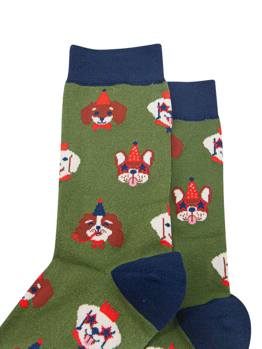 close up of the dog faces on the socks, showing in detail the party hats, glasses and accessories they are wearing