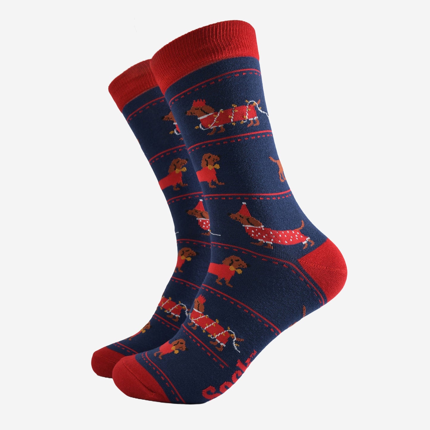 navy blue socks with a pattern on sausage dogs playing with party lights and wearing party hats
