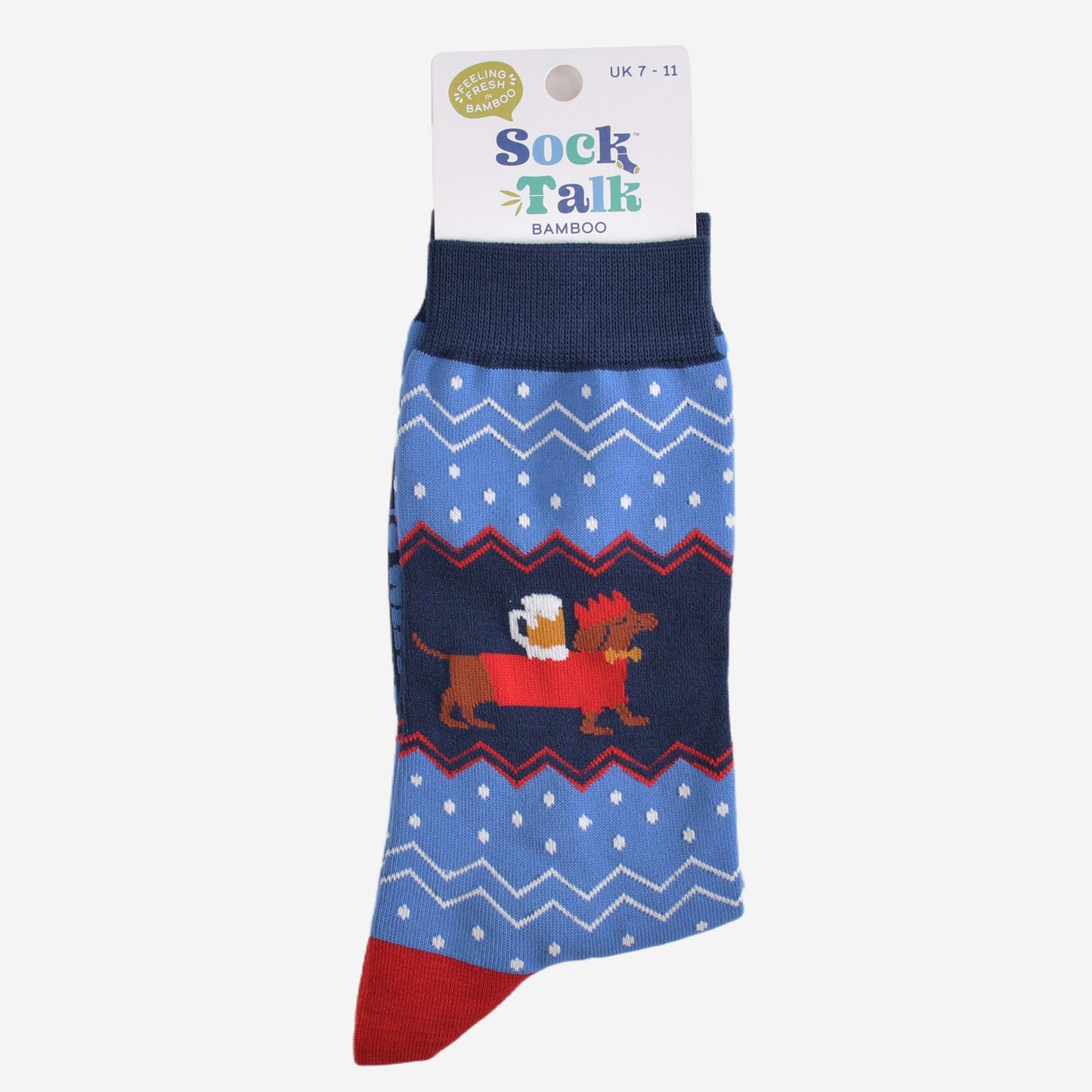 sausage dog carrying a pint of beer bamboo socks in their sock talk packaging, these socks are a uk size 7-11