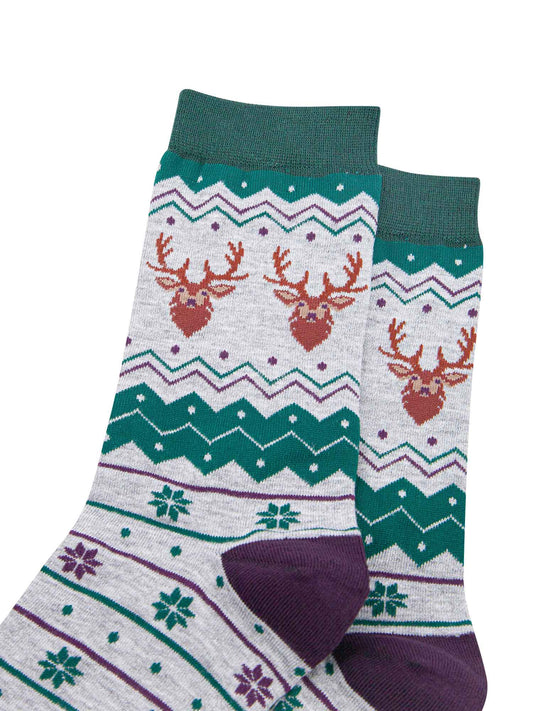 close up of the stag head patterns on the ankles of the socks