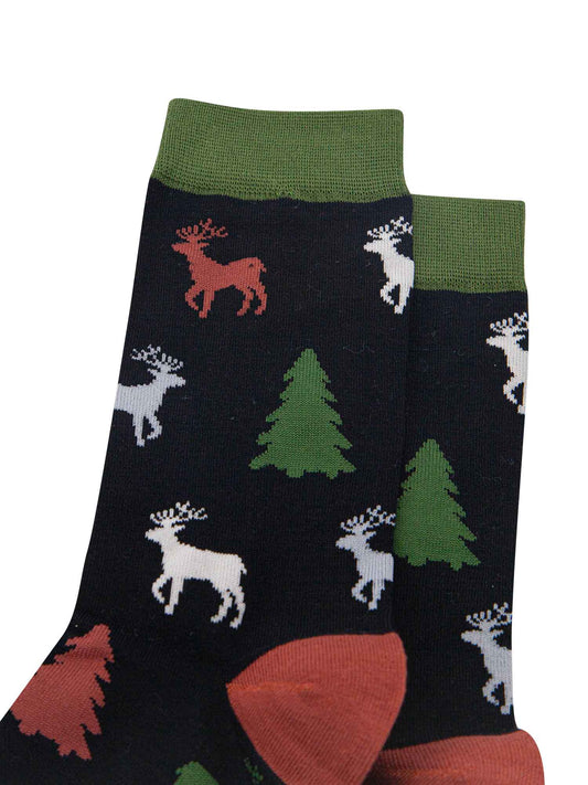 close up of the stag and xmas tree pattern, the stage are stading and profile and have clearly defined antlers