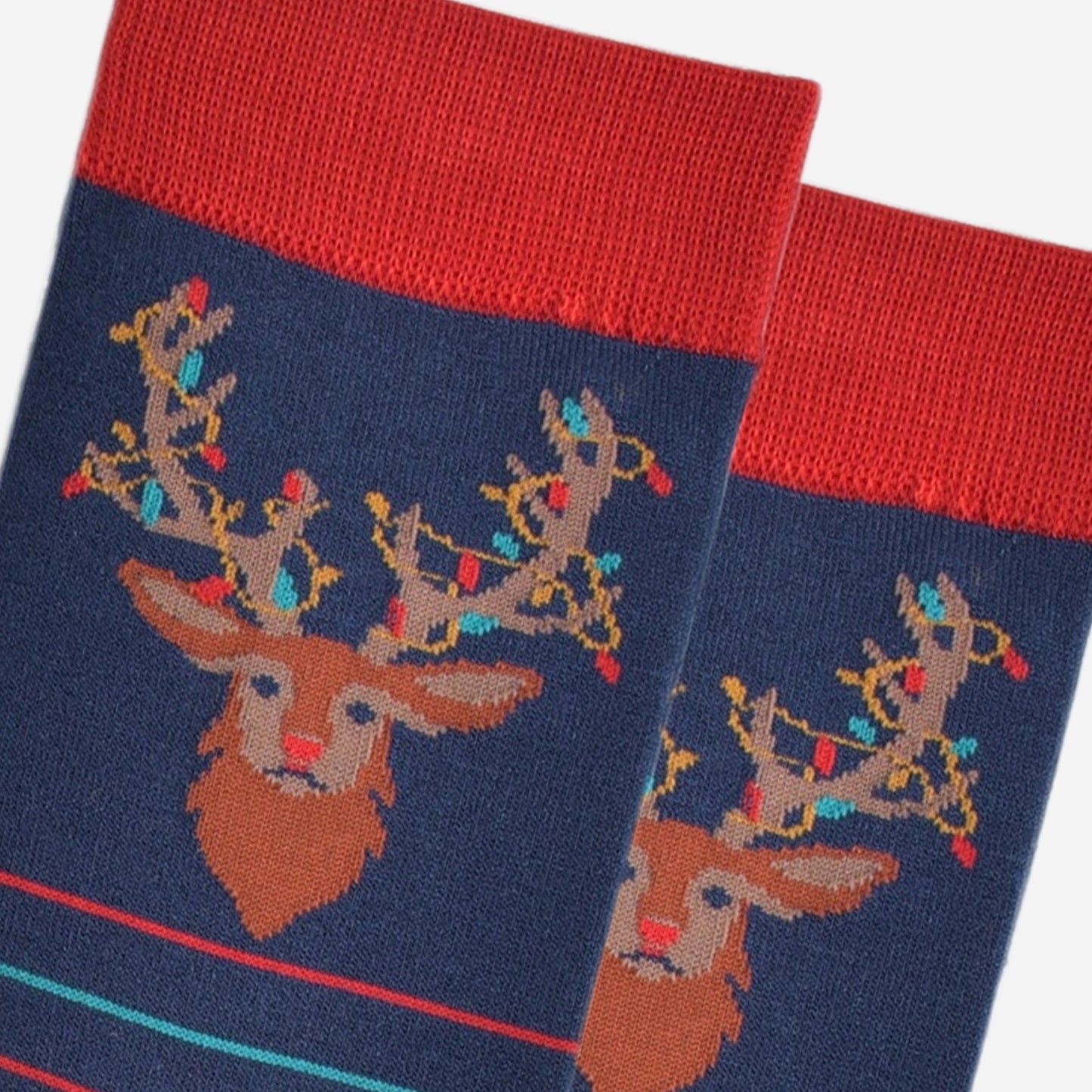 close up of the stag head design on the ankle of the socks, showing the festive party lights entangled in its antlers