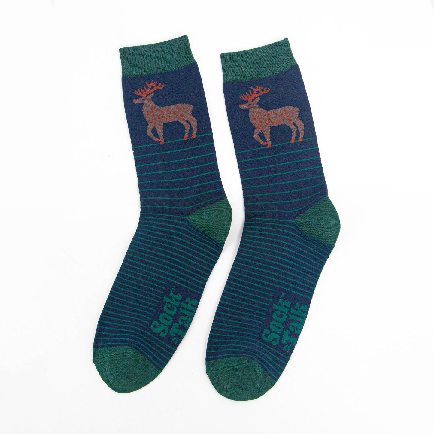 showing the navy and green striped stag socks laying flat, showing the stripe pattern and large stag standing in profile on the ankle of the socks