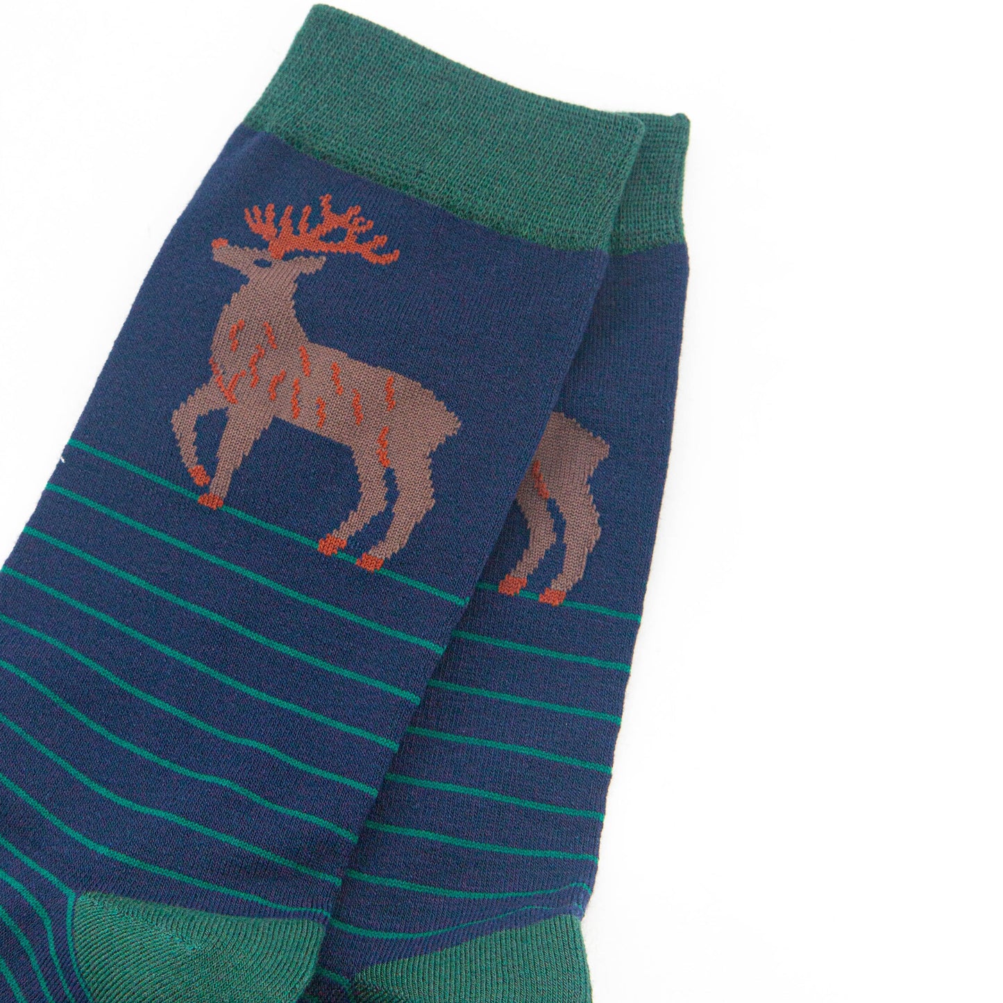 close up of the stag design on the ankle of the socks, the stag is brown with orange antlers
