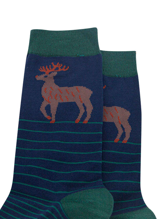 close up of the stag design on the ankle of the socks, the stag is brown with orange antlers