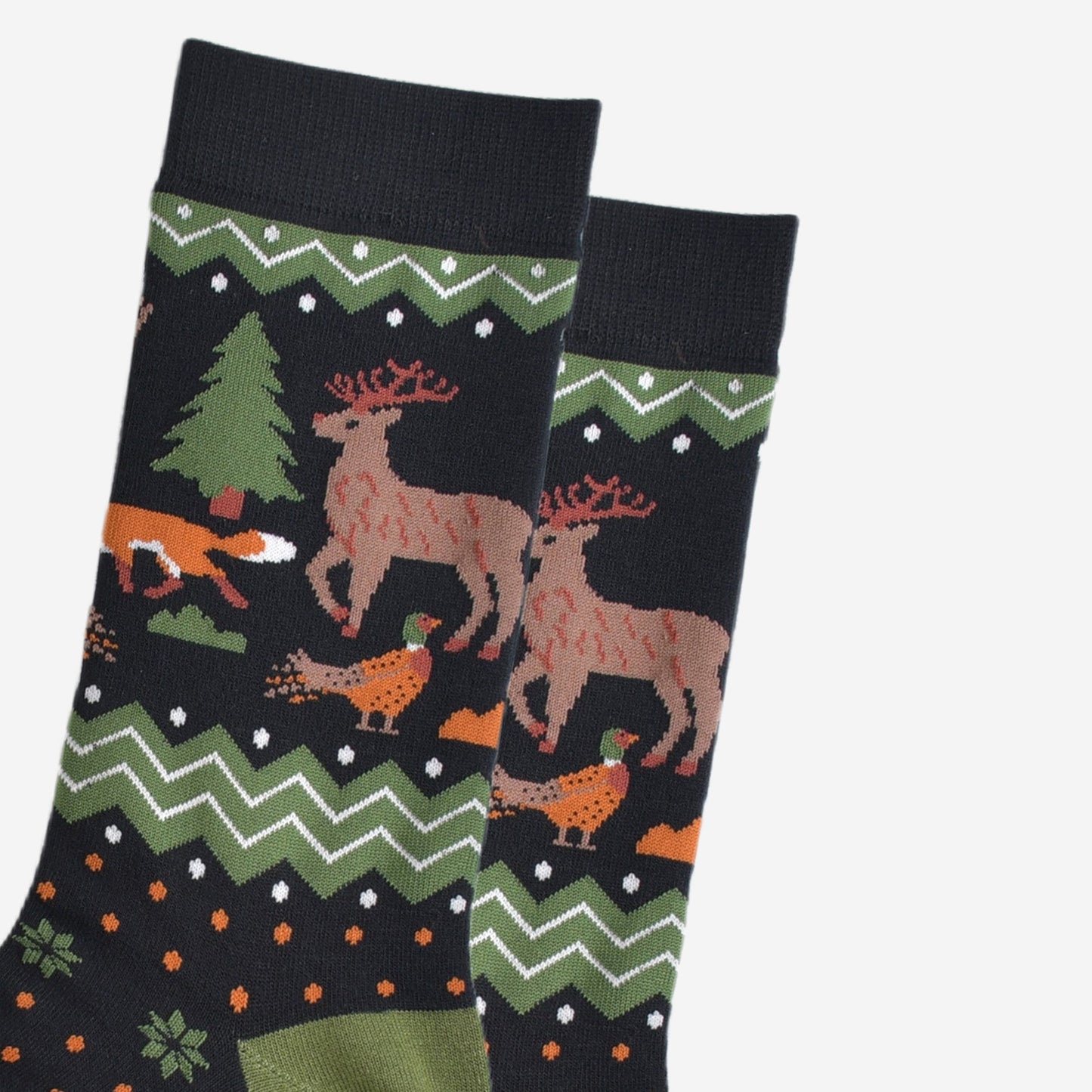 close up of the woodland animals on the ankle of the socks, there is a pheasant, red fox and stag with antlers