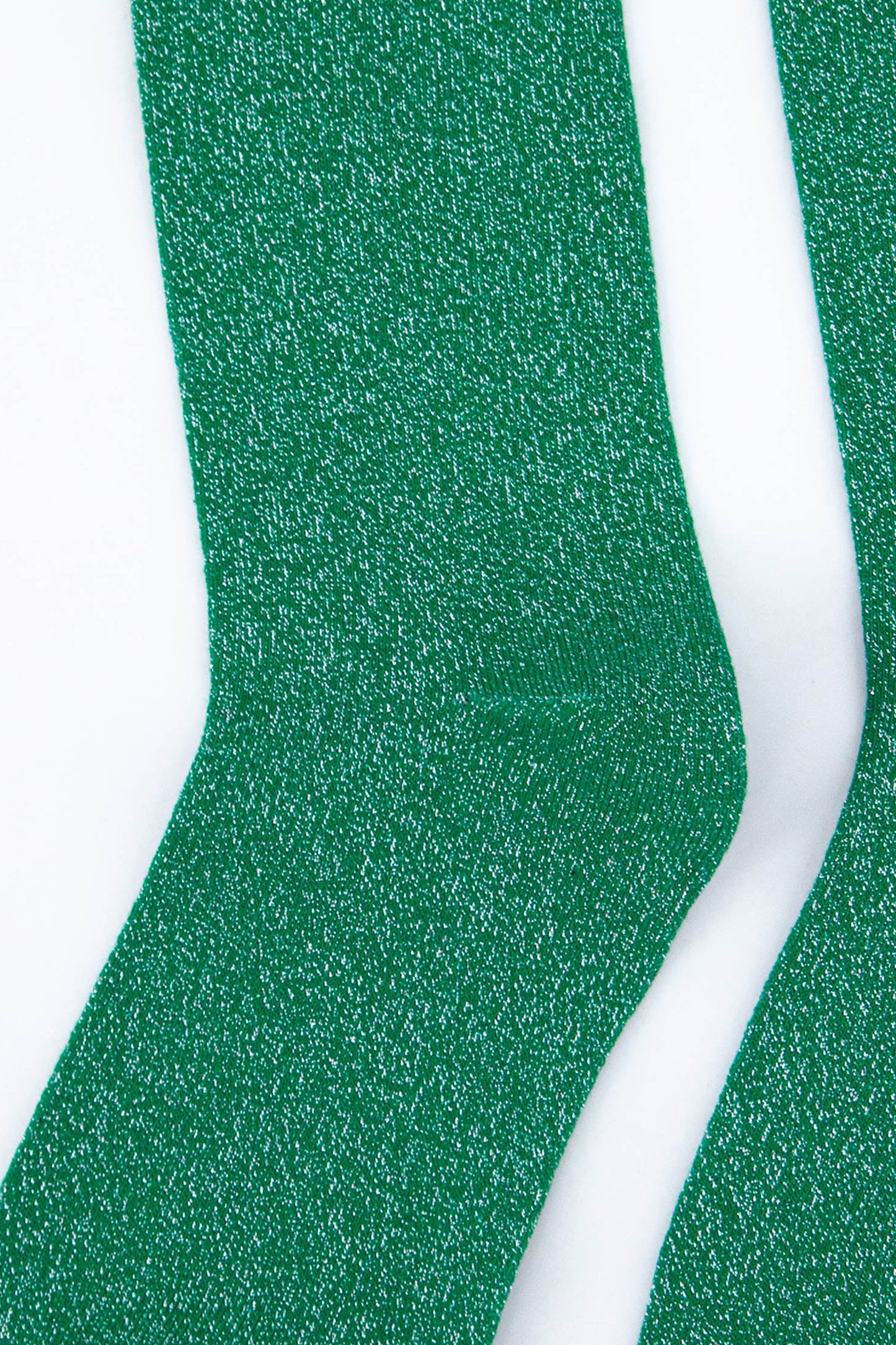 close up of the silver sparkle on these green knee high socks