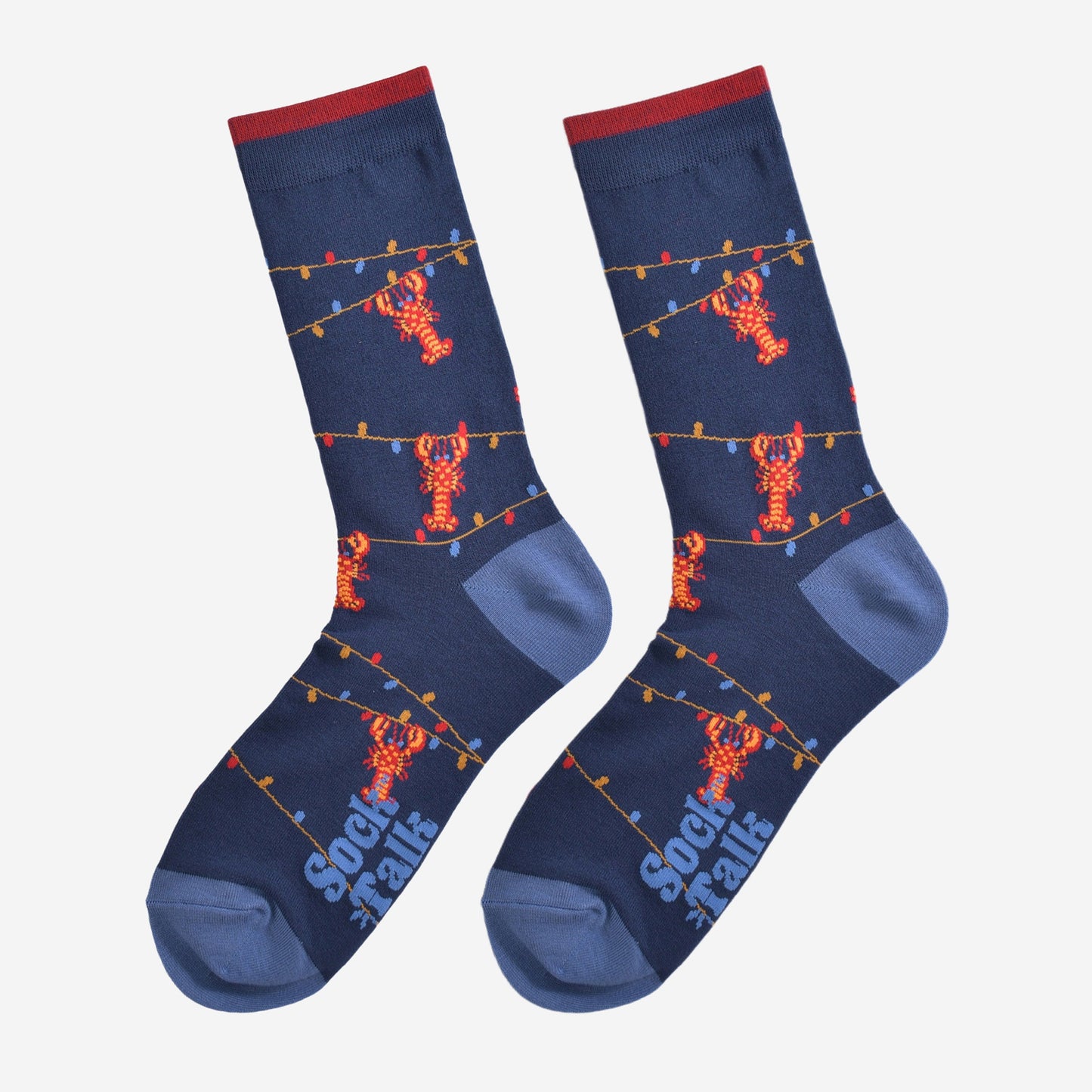 blue bamboo socks with lobsters and party lights laying flat, showing the full design of the socks