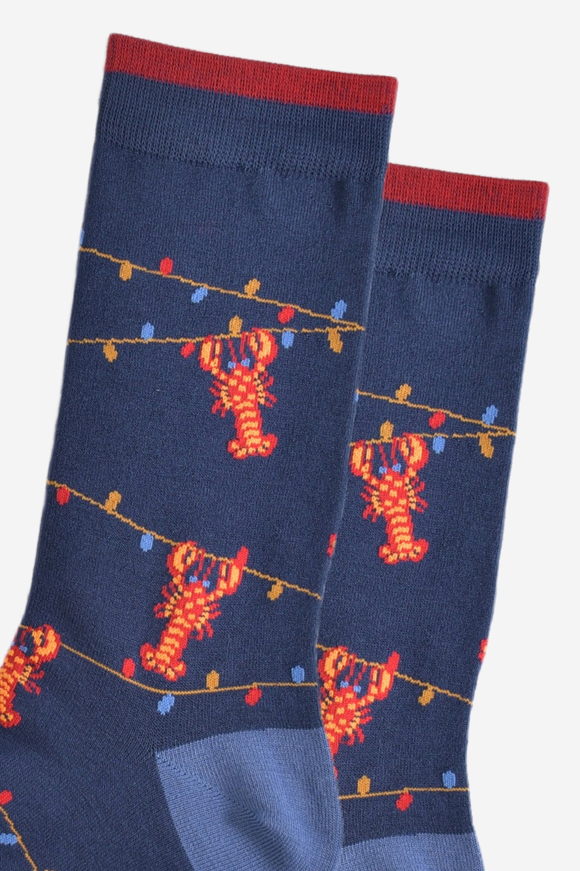 close up of the lobster and party light pattern on the bamboo socks, showing the colourful party lights