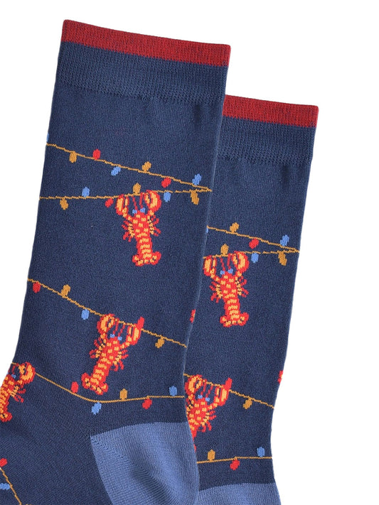 close up of the lobster and party light pattern on the bamboo socks, showing the colourful party lights