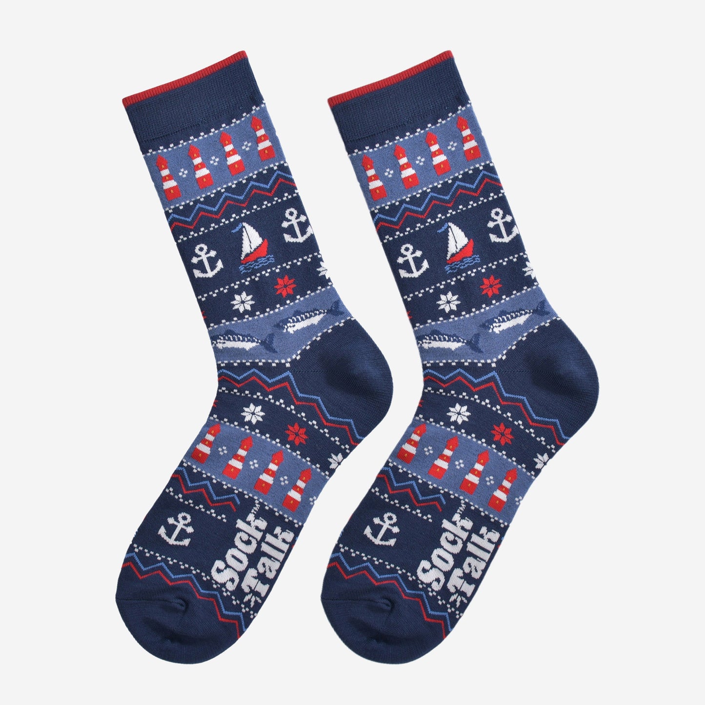 navy blue nautical fair isle socks laying flat, showing the intricate design which includes fish, anchors, boats and lighthouses