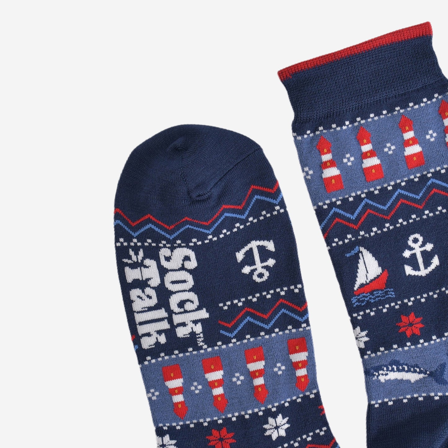 showing the toe and cuff of the fair isle nautical socks, the cuff has a subtle burgundy stripe on the edge, the toe is plain navy blue