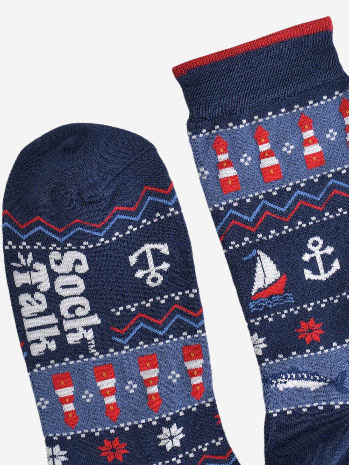 showing the toe and cuff of the fair isle nautical socks, the cuff has a subtle burgundy stripe on the edge, the toe is plain navy blue