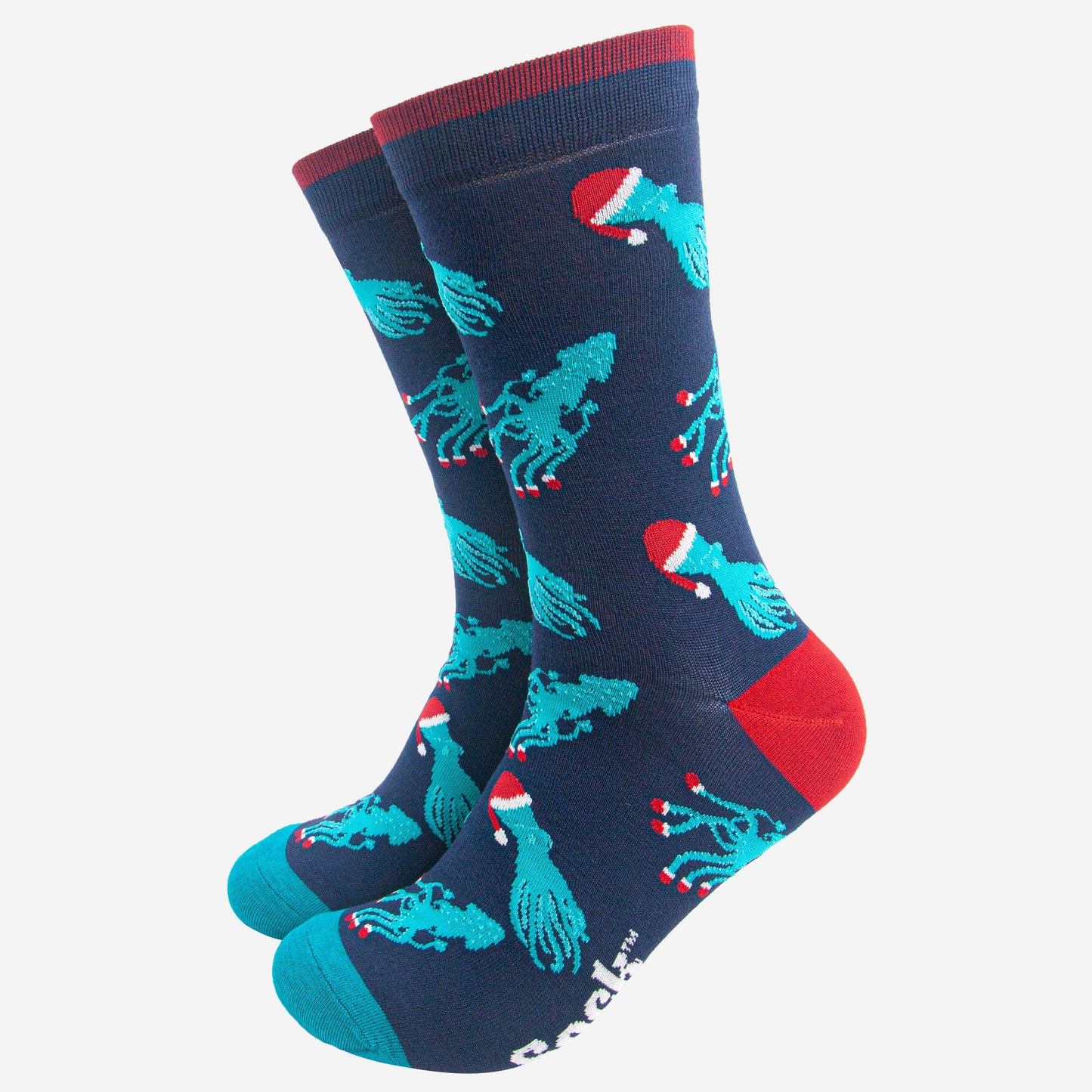 navy blue socks with an all over pattern of electric blue squid and octopus wearing santa hats