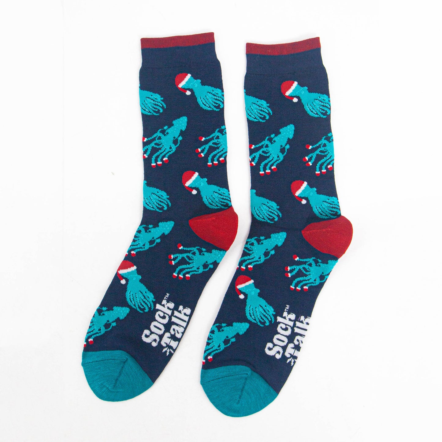 showing the christmas octopus and squid socks laying flat, there is an all over pattern of electric blue coloured squid and octopus wearing santa hats and santa slippers