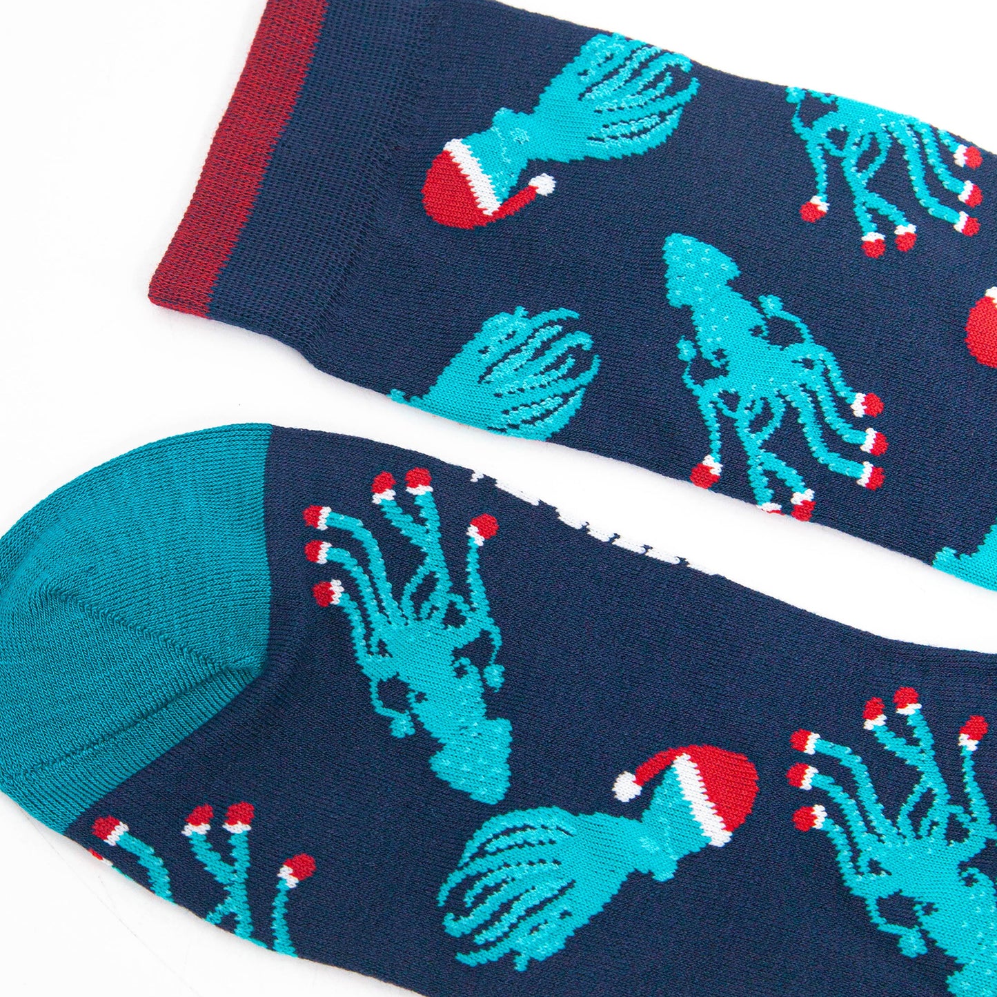 close up of the toe and cuff, the toe is teal blue, the cuff has burgundy red stripe on the edge