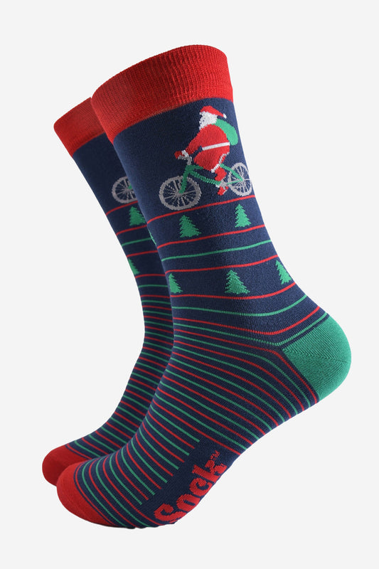 navy blue, green and red striped dress socks showcasing santa claus cycling on the ankle of the sock