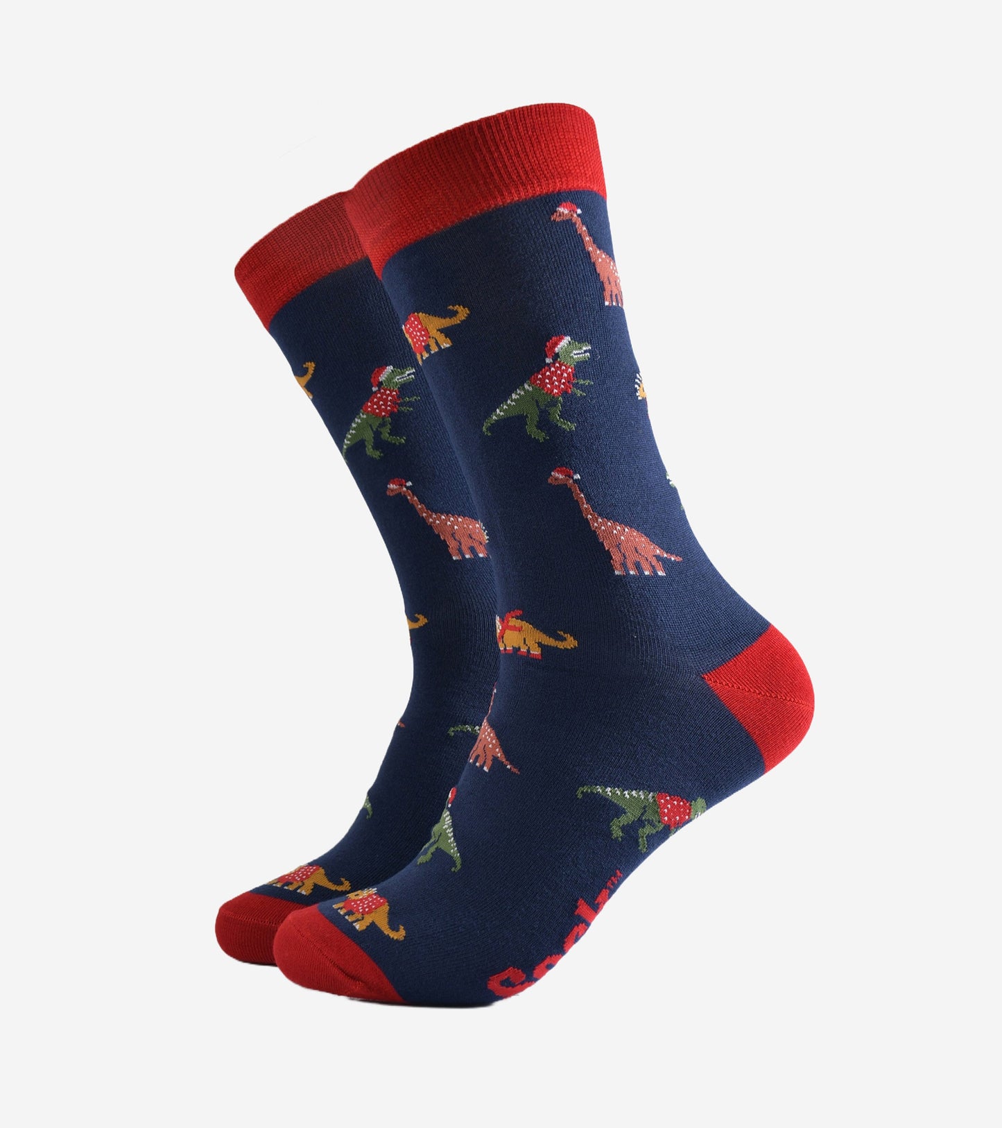 navy blue dress socks with a red heel, toe and cuff with a pattern of colourful dinosaurs wearing santa hats