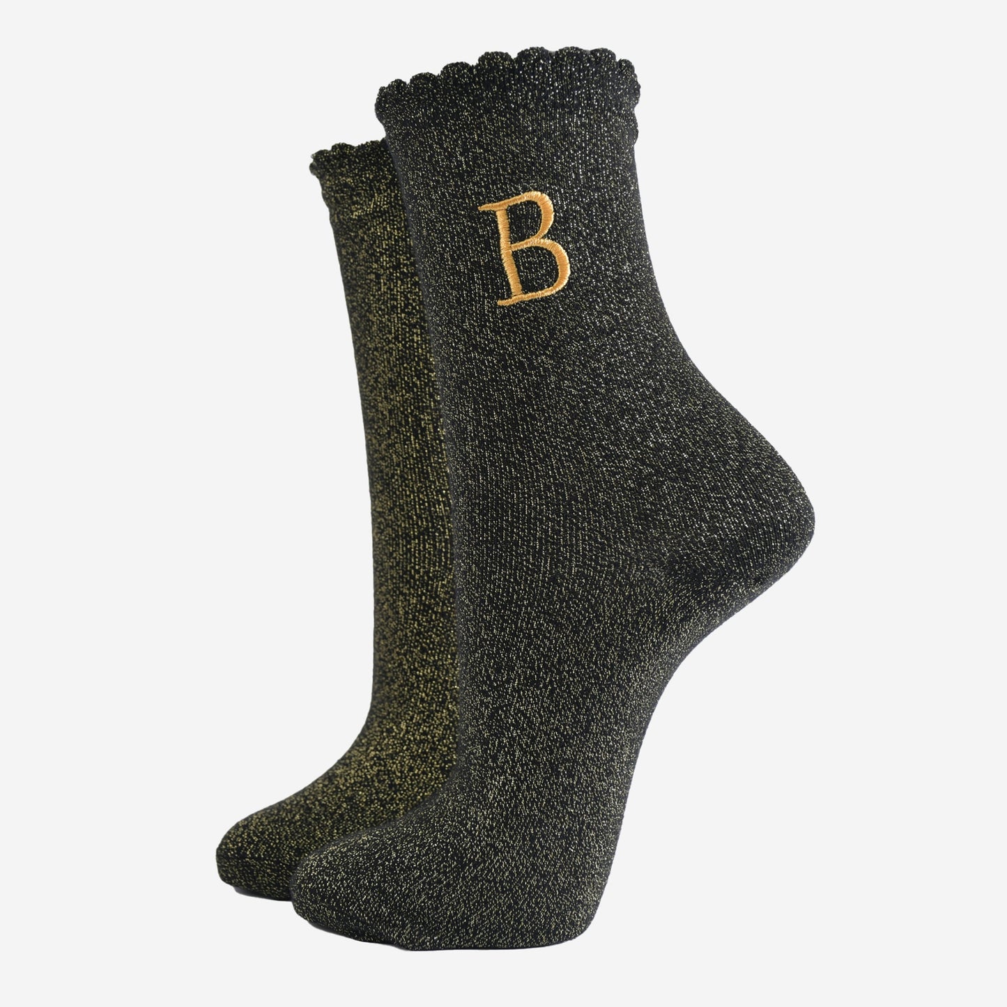 black ankle socks with a scalloped cuff, with an all over gold glitter sparkle and an embroidered gold letter b on the ankle