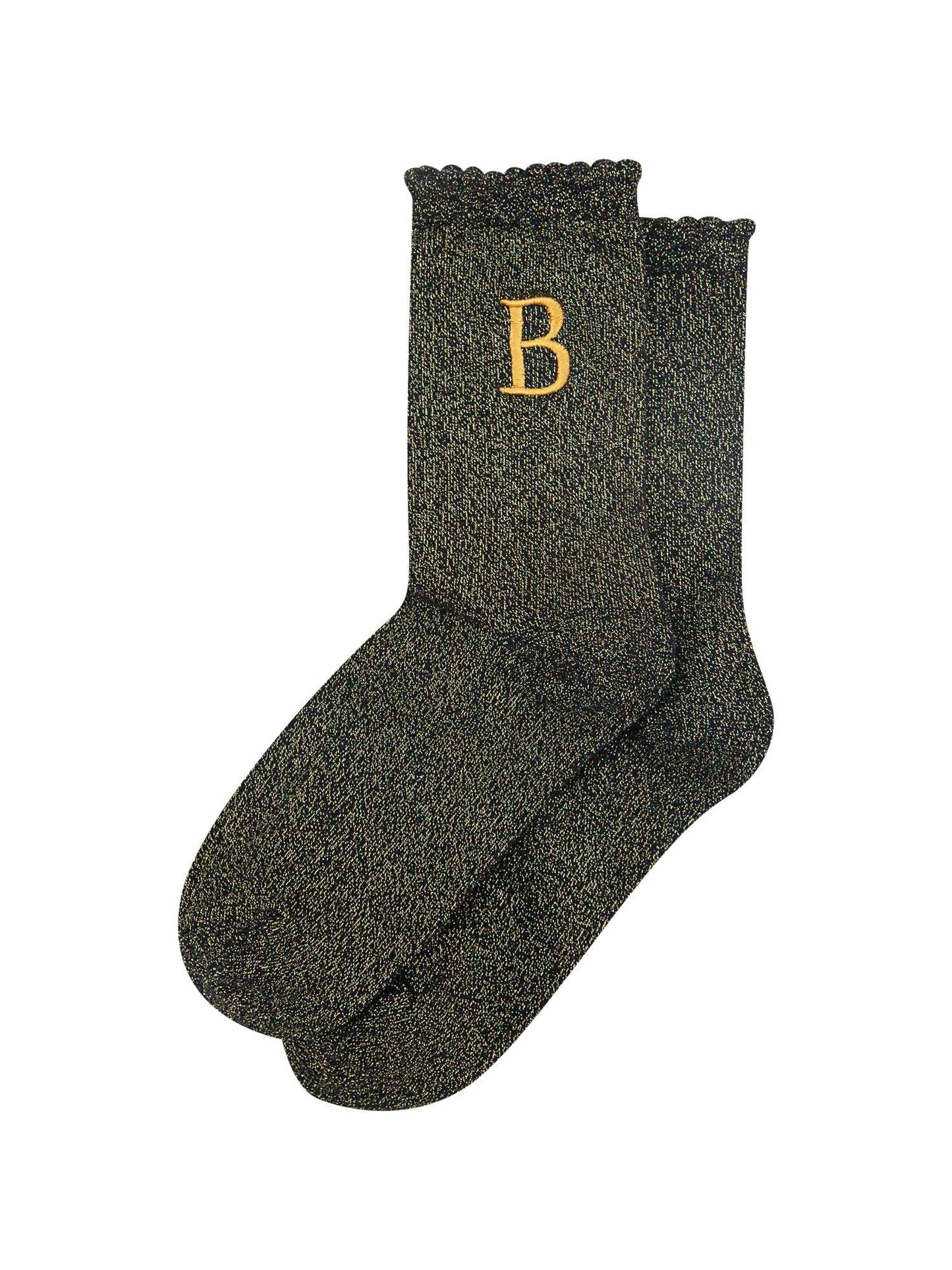 showing the glitter socks laying flat, they have a scalloped cuff and an all over gold sparkle