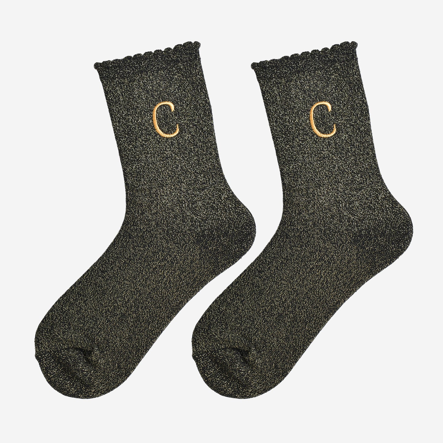 showing the glitter socks laying flat, they have a scalloped cuff and an all over gold sparkle