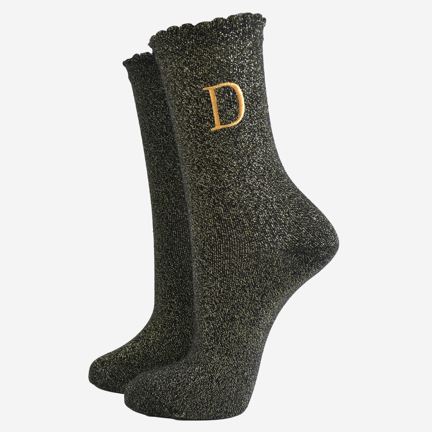 black ankle socks with a scalloped cuff, with an all over gold glitter sparkle and an embroidered gold letter d on the ankle