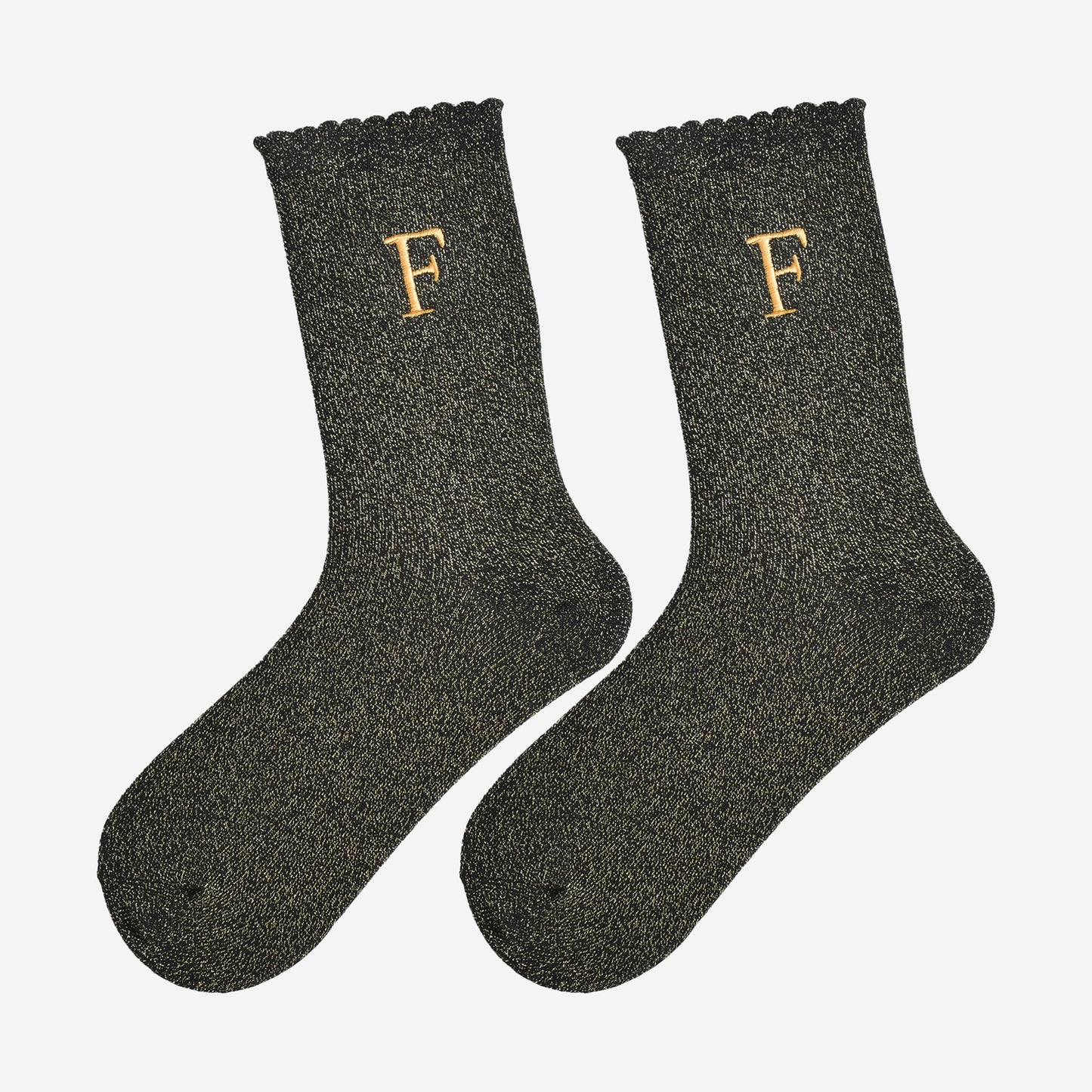 showing the glitter socks laying flat, they have a scalloped cuff and an all over gold sparkle