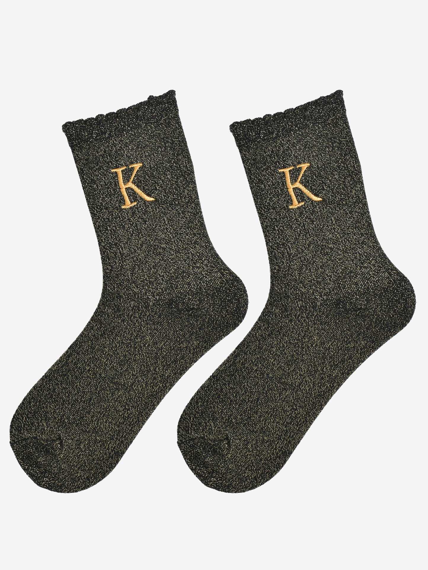 showing the glitter socks laying flat, they have a scalloped cuff and an all over gold sparkle
