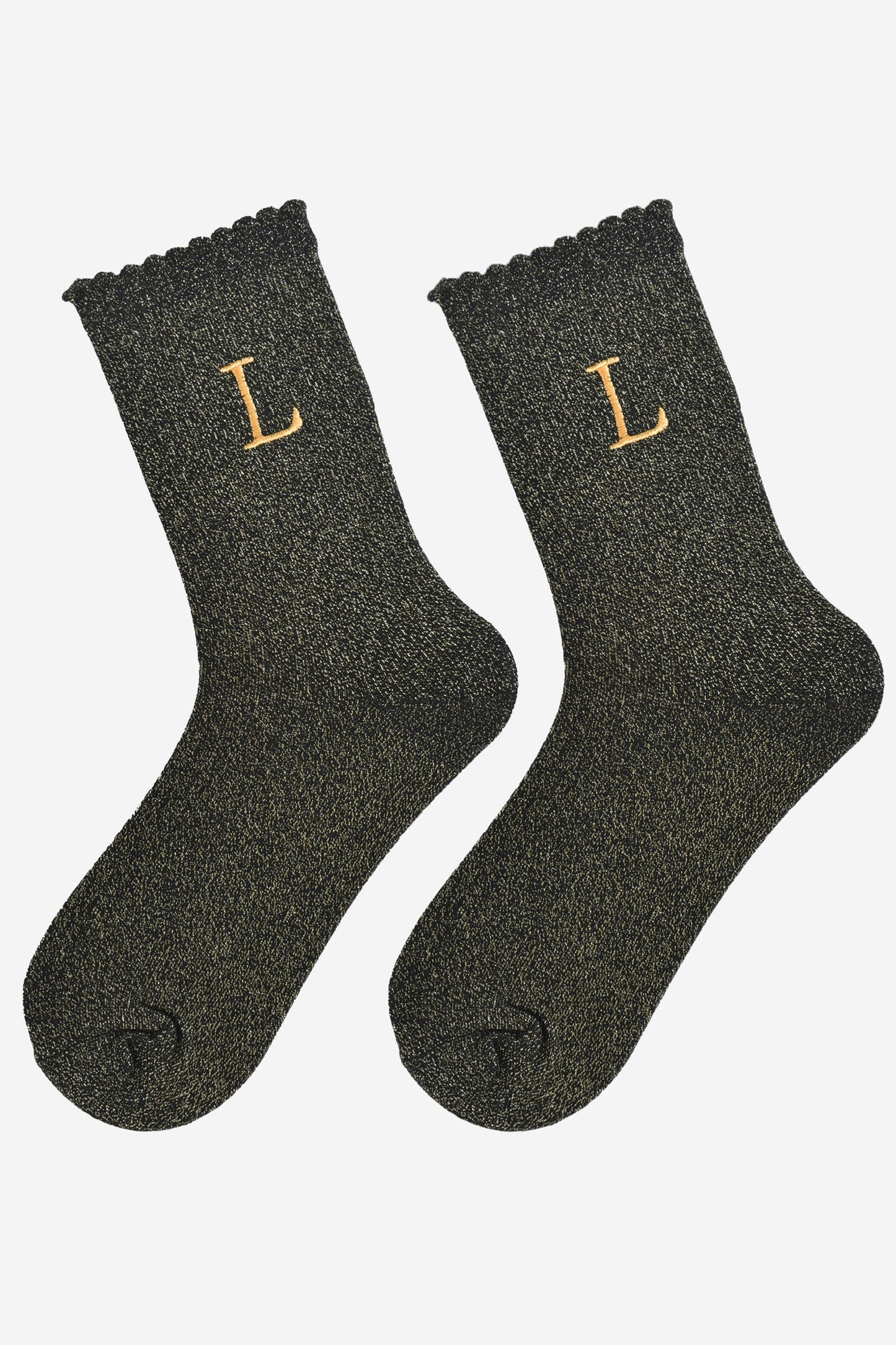 showing the glitter socks laying flat, they have a scalloped cuff and an all over gold sparkle