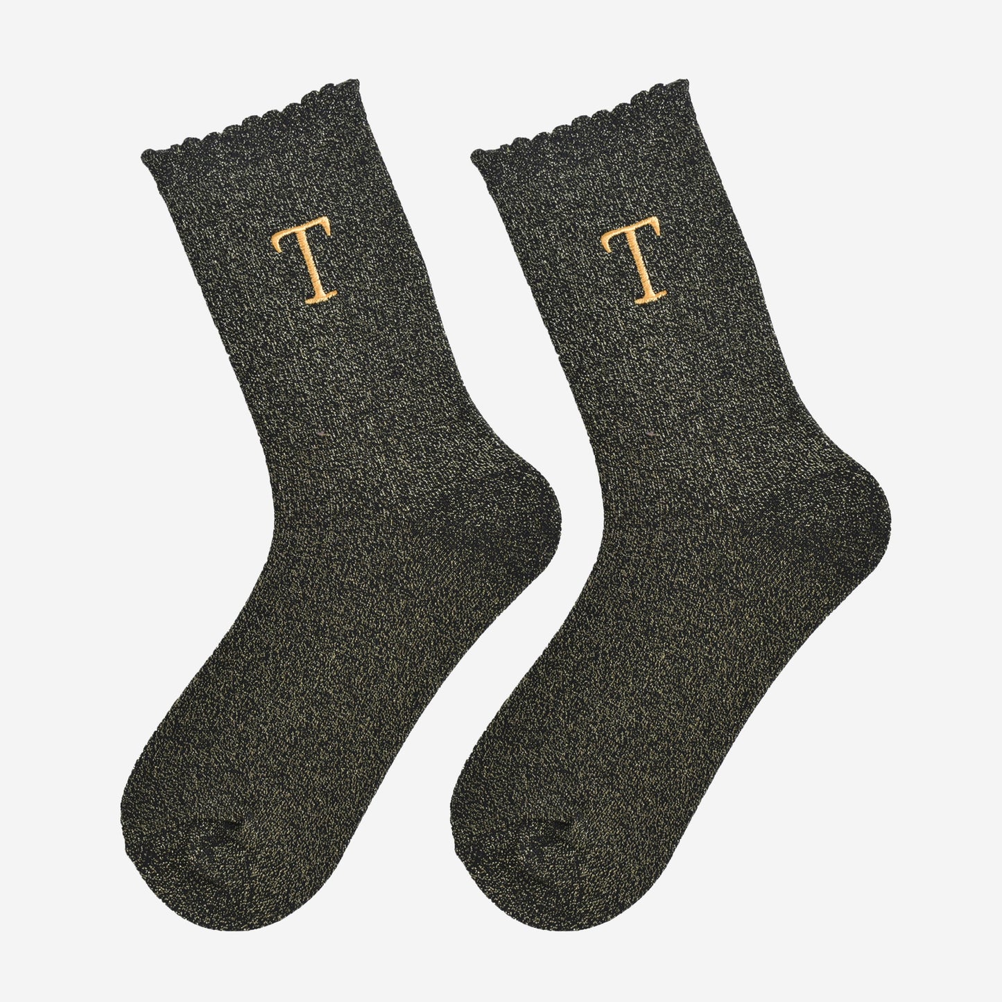 showing the glitter socks laying flat, they have a scalloped cuff and an all over gold sparkle