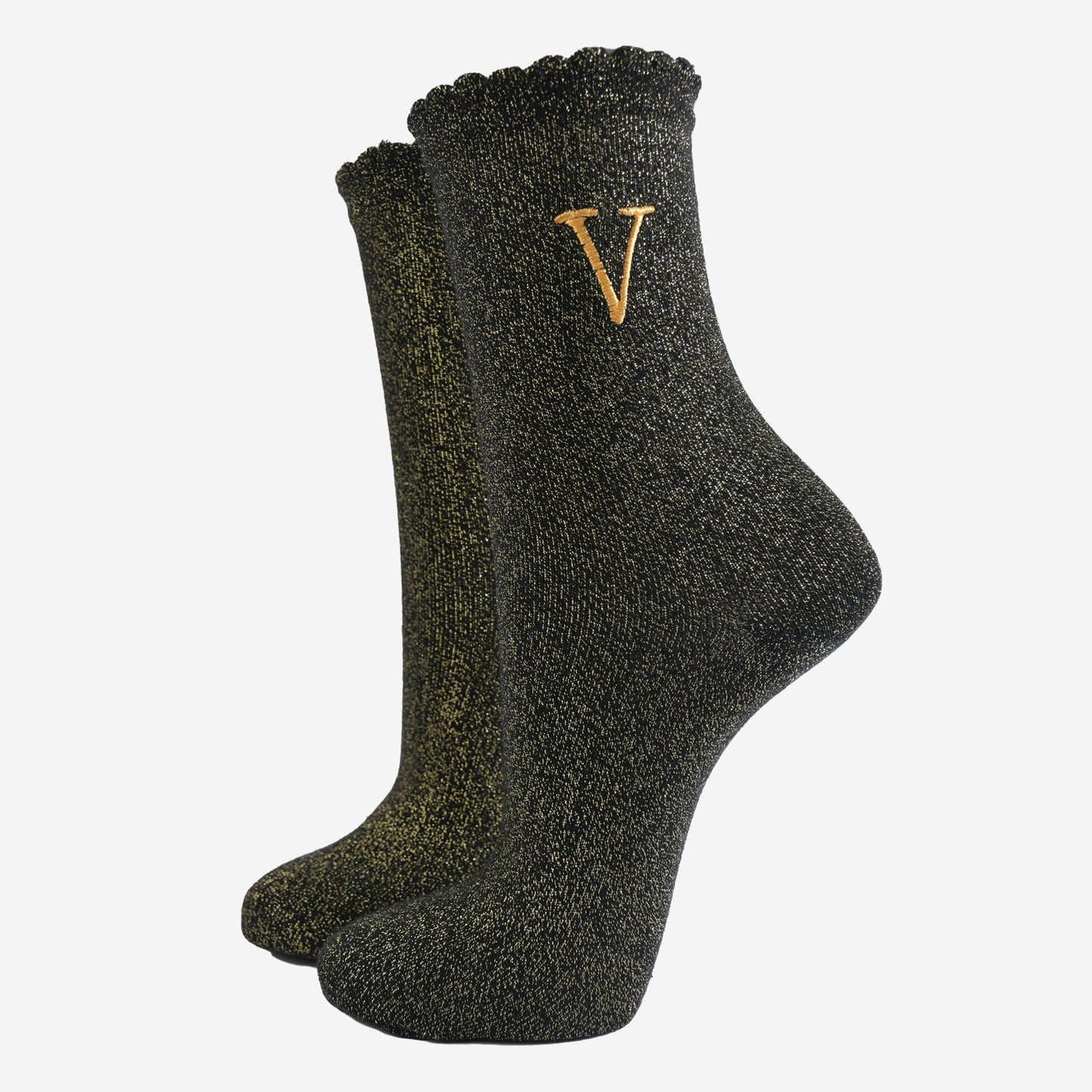 black ankle socks with a scalloped cuff, with an all over gold glitter sparkle and an embroidered gold letter v on the ankle