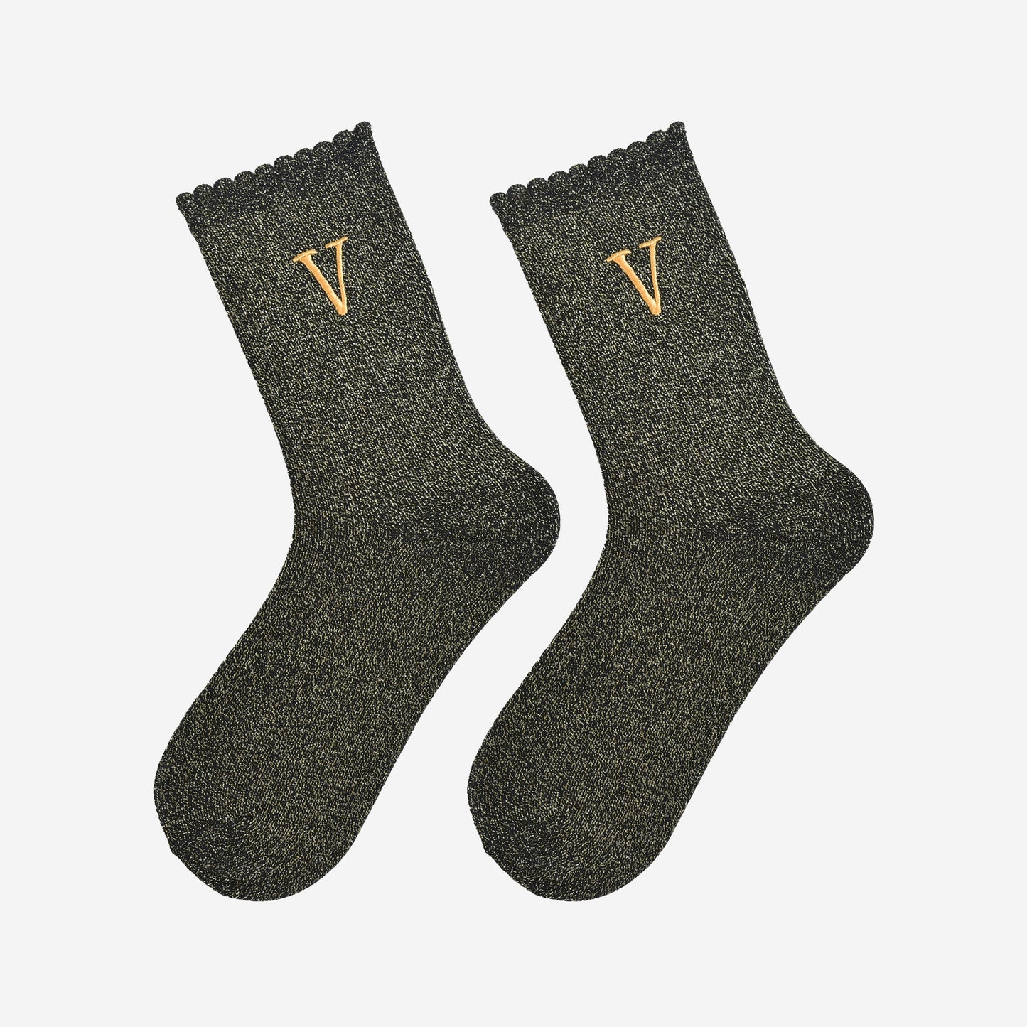 showing the glitter socks laying flat, they have a scalloped cuff and an all over gold sparkle
