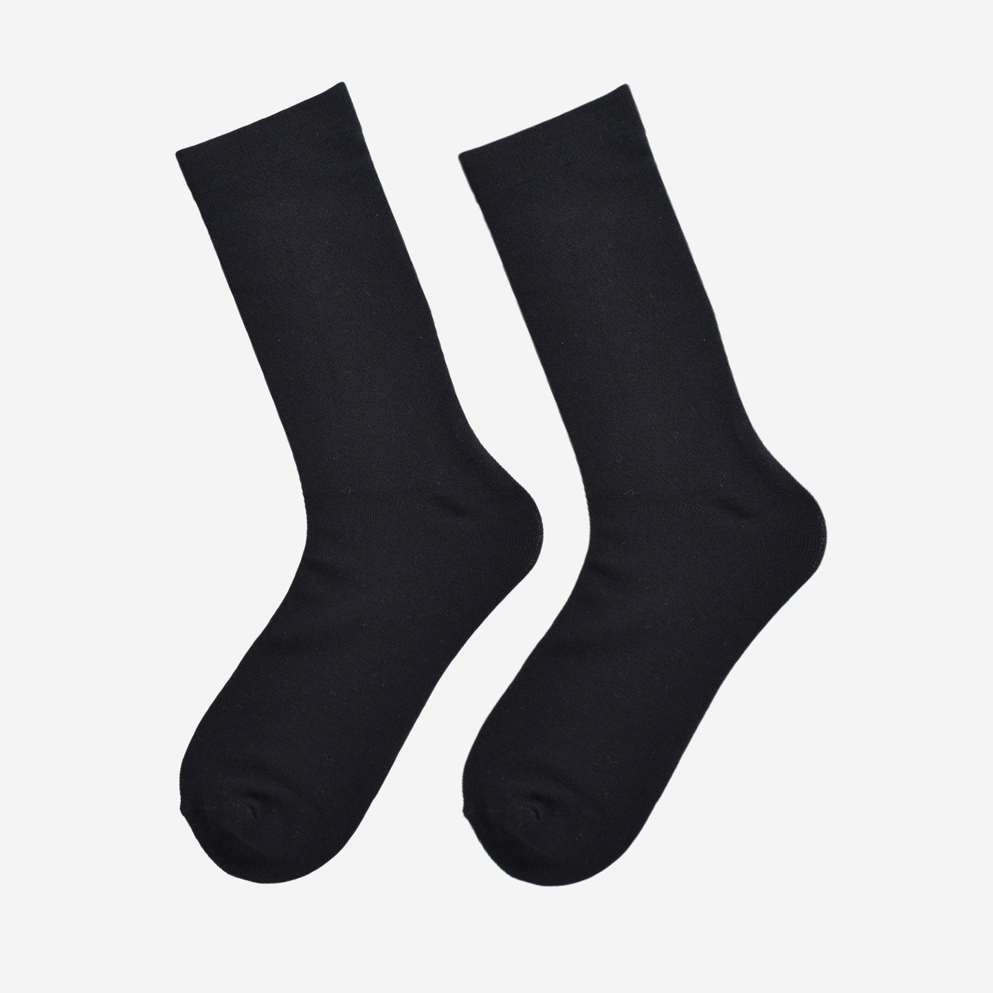 plain black bamboo socks laying flat, showing the all over consistent colour