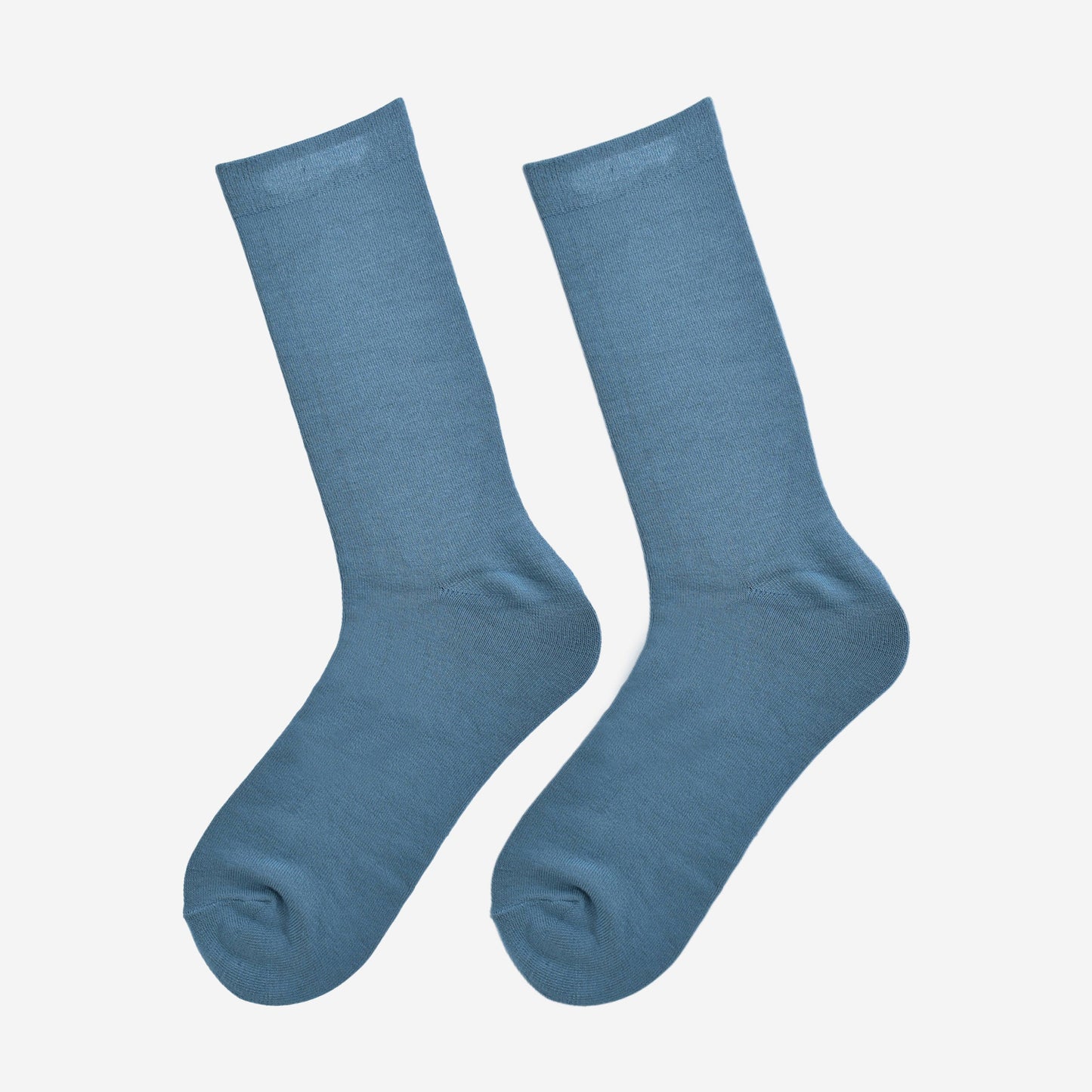 teal blue bamboo socks laying flat, showing the all over consistent colour