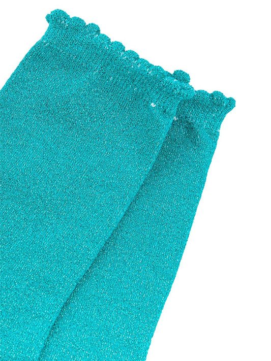 close up of the sparkly glitter material and scalloped cuff edges
