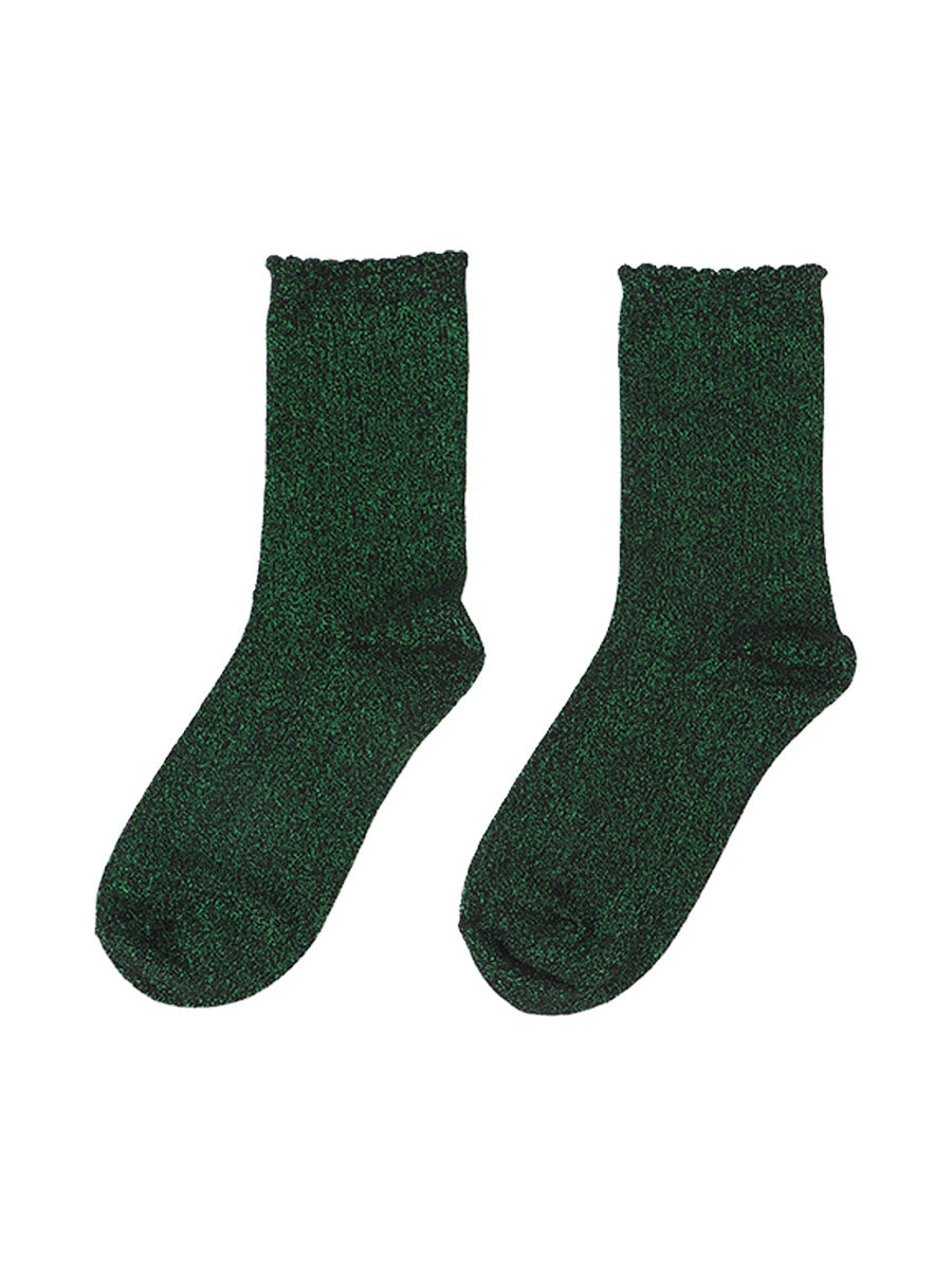 black cotton socks with an all over bright green glitter shimmer, the socks have a scalloped cuff edge