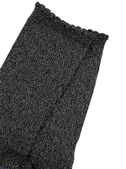close up of the black and silver glitter socks and scalloped cuffs