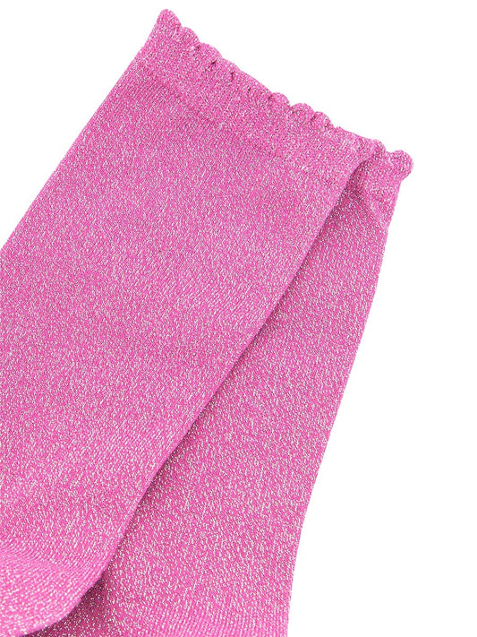 close up of the sparkly glitter material and scalloped cuff edges