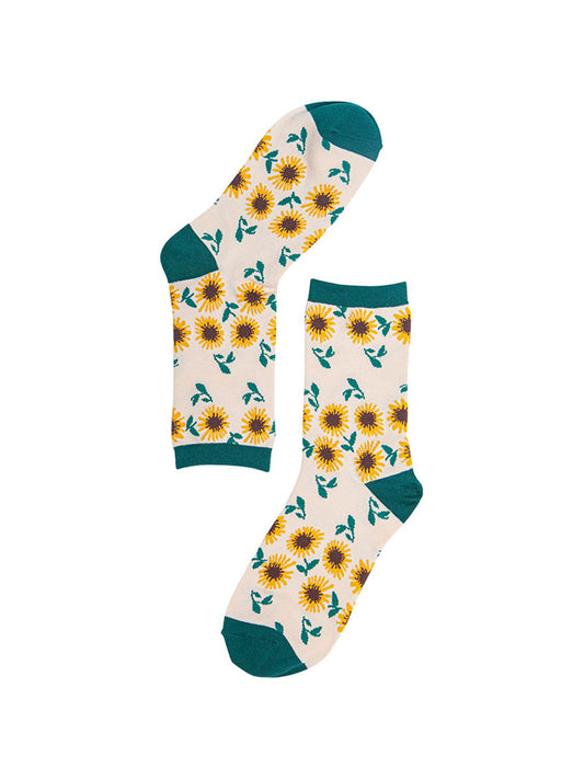 cream, green bamboo socks with a yellow sunflower print