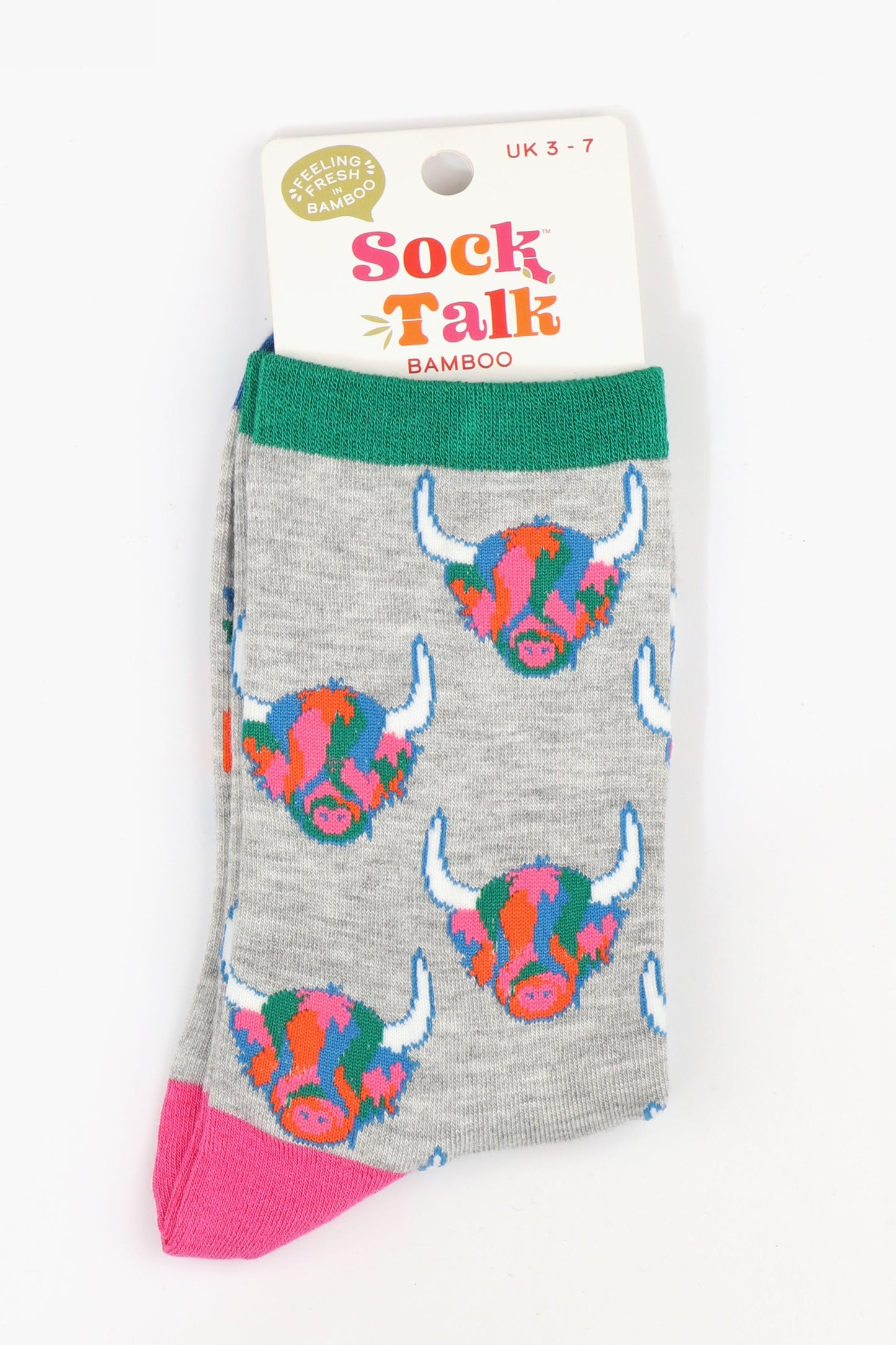 ladies grey bamboo socks with an all over pattern of colourful highland cow faces, uk size 3-7