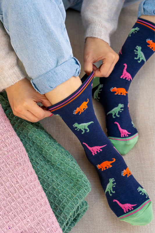 womens-bamboo-socks-navy-multi-dinosaurs-worn-by-model