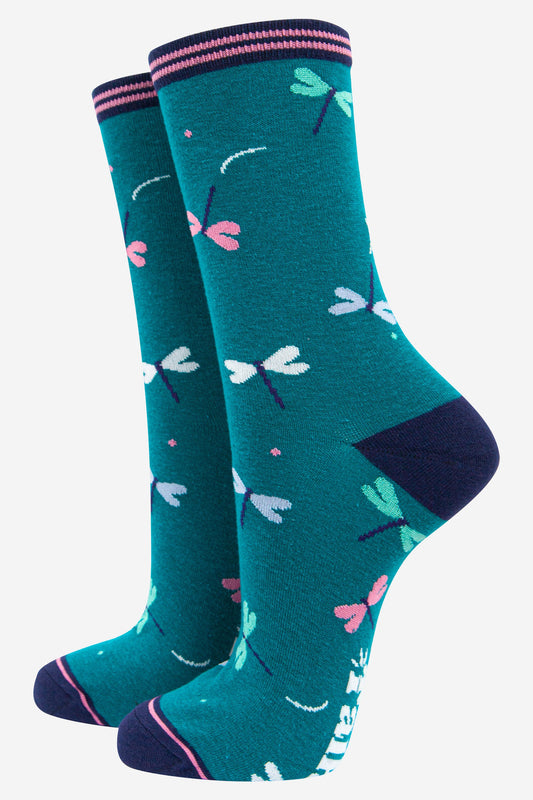 blue bamboo socks with a pattern of white, blue and pink dragonflies