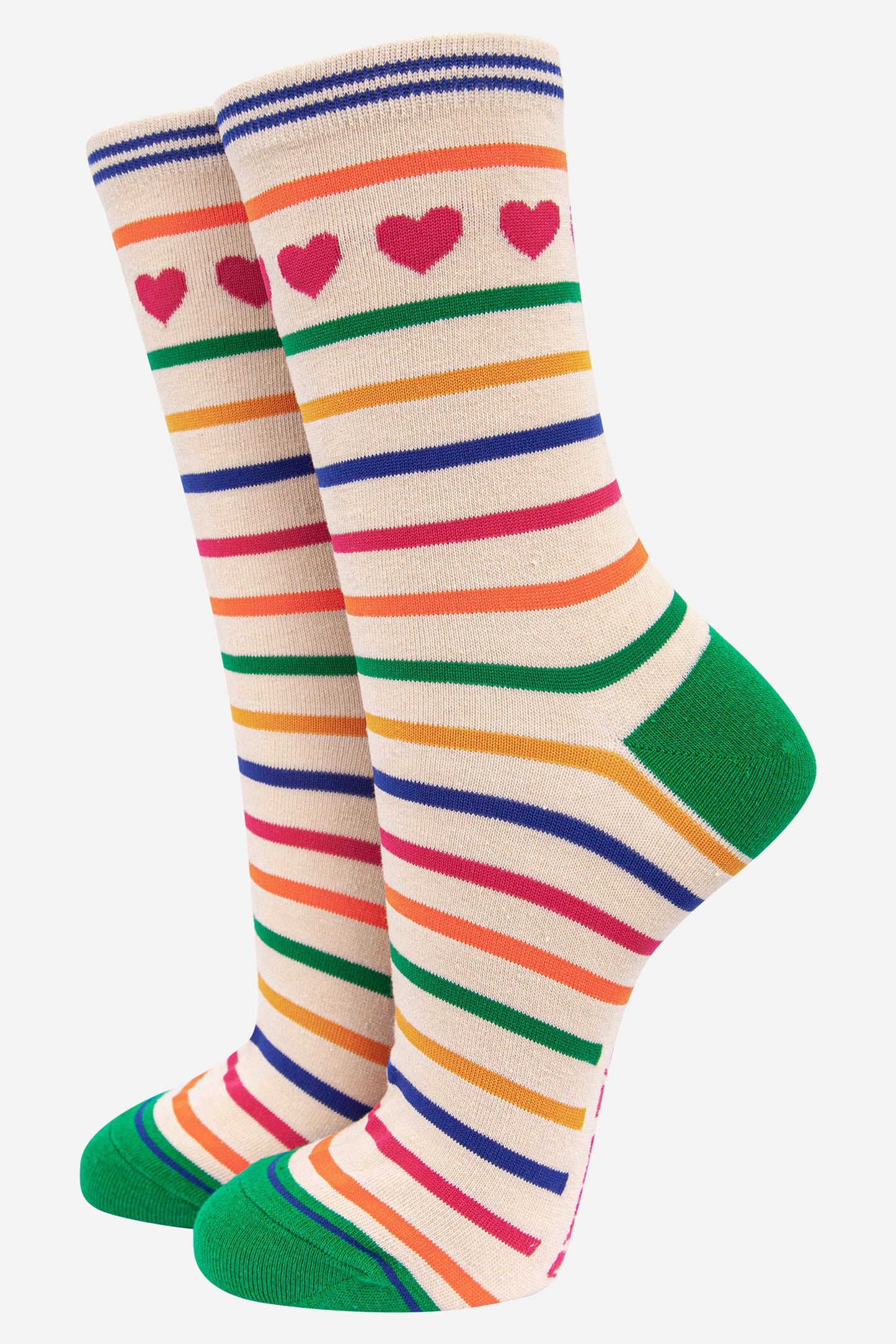 cream bamboo socks with a multicoloured rainbow stripe pattern and pink love hearts